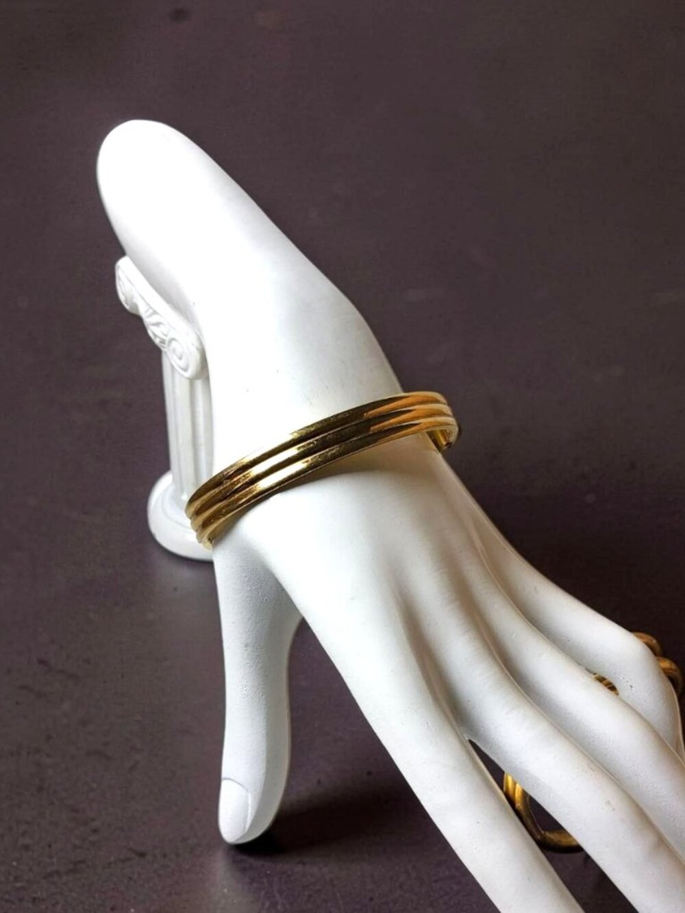 Vintage Monet Gold Tone 8.5 in diameter 1in wide bangle spring open bracelet.
